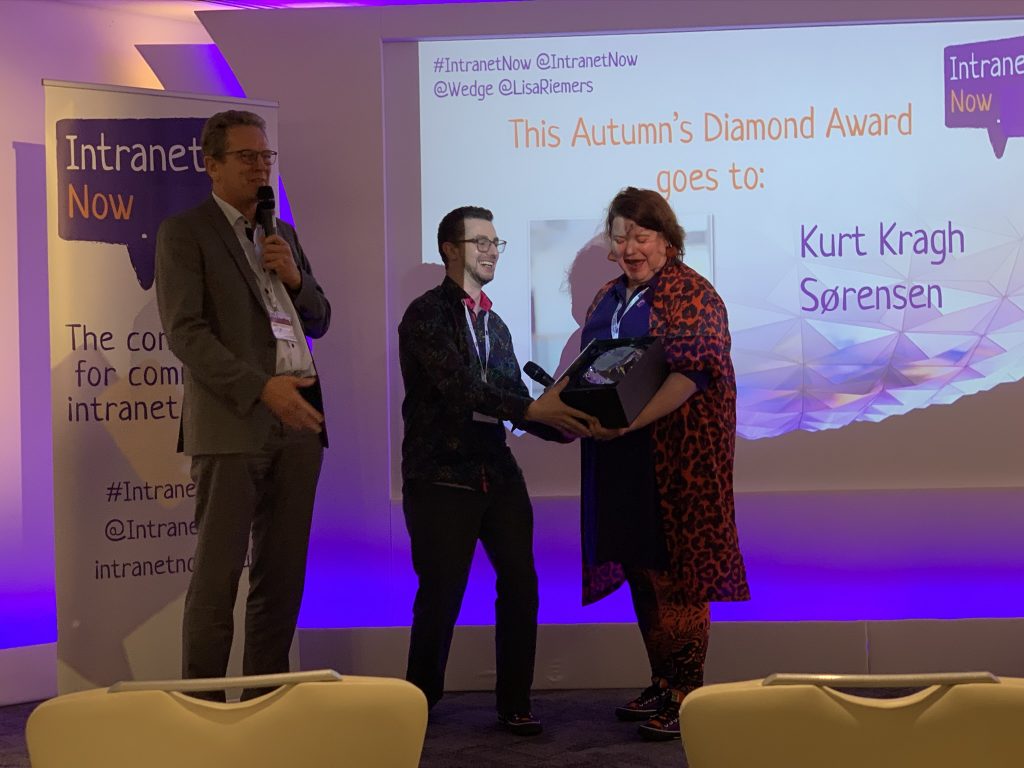 Wedge and Lisa presenting the Intranet Diamond award to Kurt 